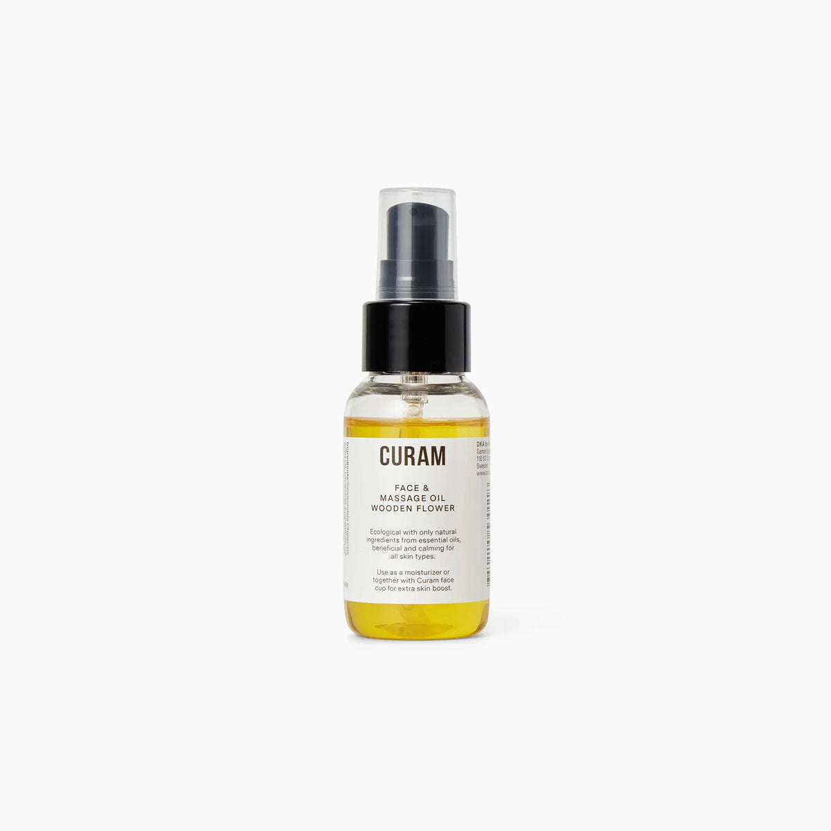 Curam Face Oil i flaska med svart pumpdispenser, fylld med en gyllengul ekologisk blandning av jojoba och essentiella oljor för ansiktskoppning och massage.