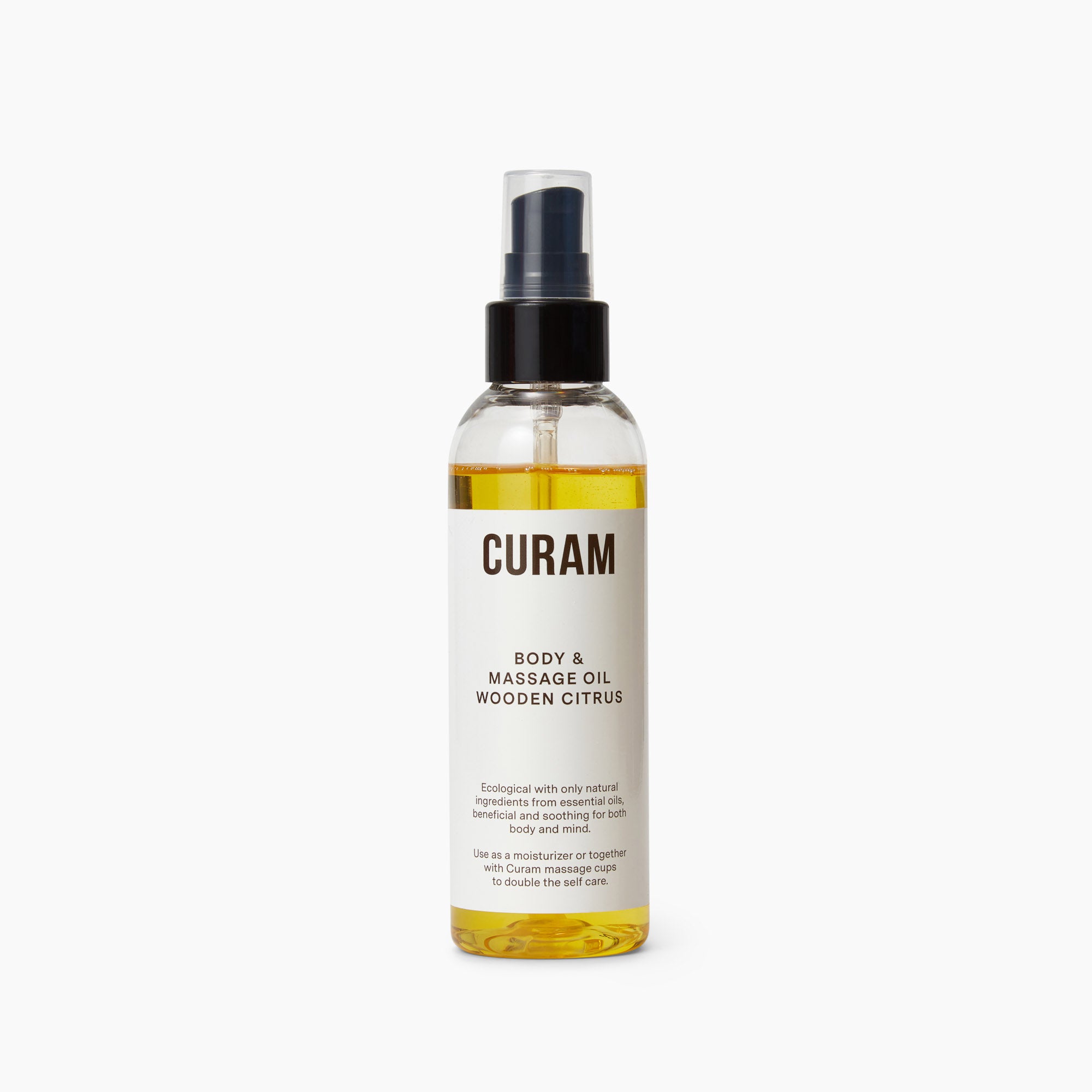 Curam Body Oil in Wooden Citrus scent, shown in a sleek clear bottle with a black pump dispenser and minimalist label, features a golden-hued, natural oil blend designed for cupping massage and daily moisturizing.